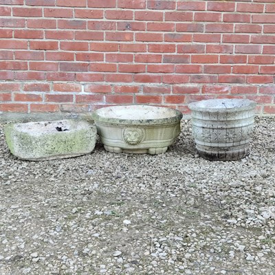 Lot 1524 - A small stone trough and two cast reconstituted stone planters