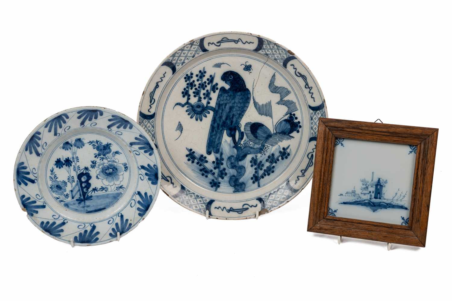 Lot 1145 - Two Delftware plates and a framed tile