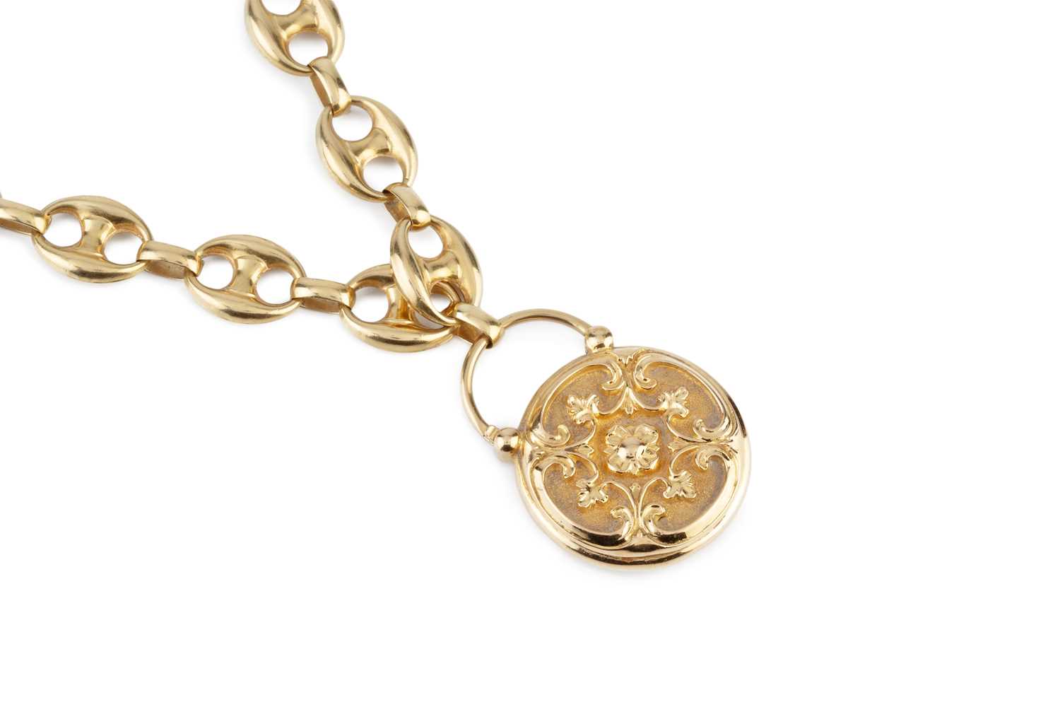 Lot 23 - A memorial locket pendant, embossed with a...