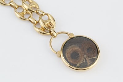 Lot 23 - A memorial locket pendant, embossed with a...