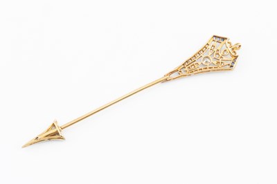 Lot 120 - A diamond and gem set jabot pin, designed as...