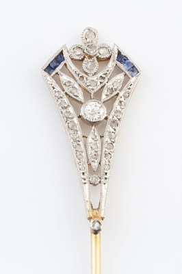 Lot 120 - A diamond and gem set jabot pin, designed as...