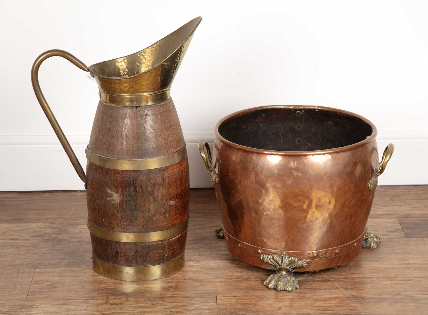 Lot 76 - Copper log-bin with brass handles and feet,...