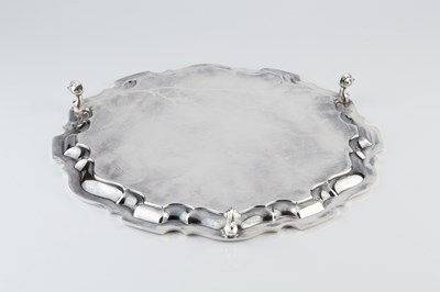 Lot 546 - A silver salver, with shaped border, engraved...