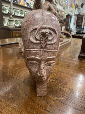 Lot 365 - A museum copy of a porphyry Ancient Egyptian bust of a Pharoah
