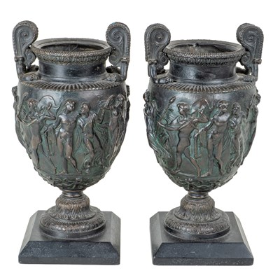 Lot 1053 - A pair of bronze urns