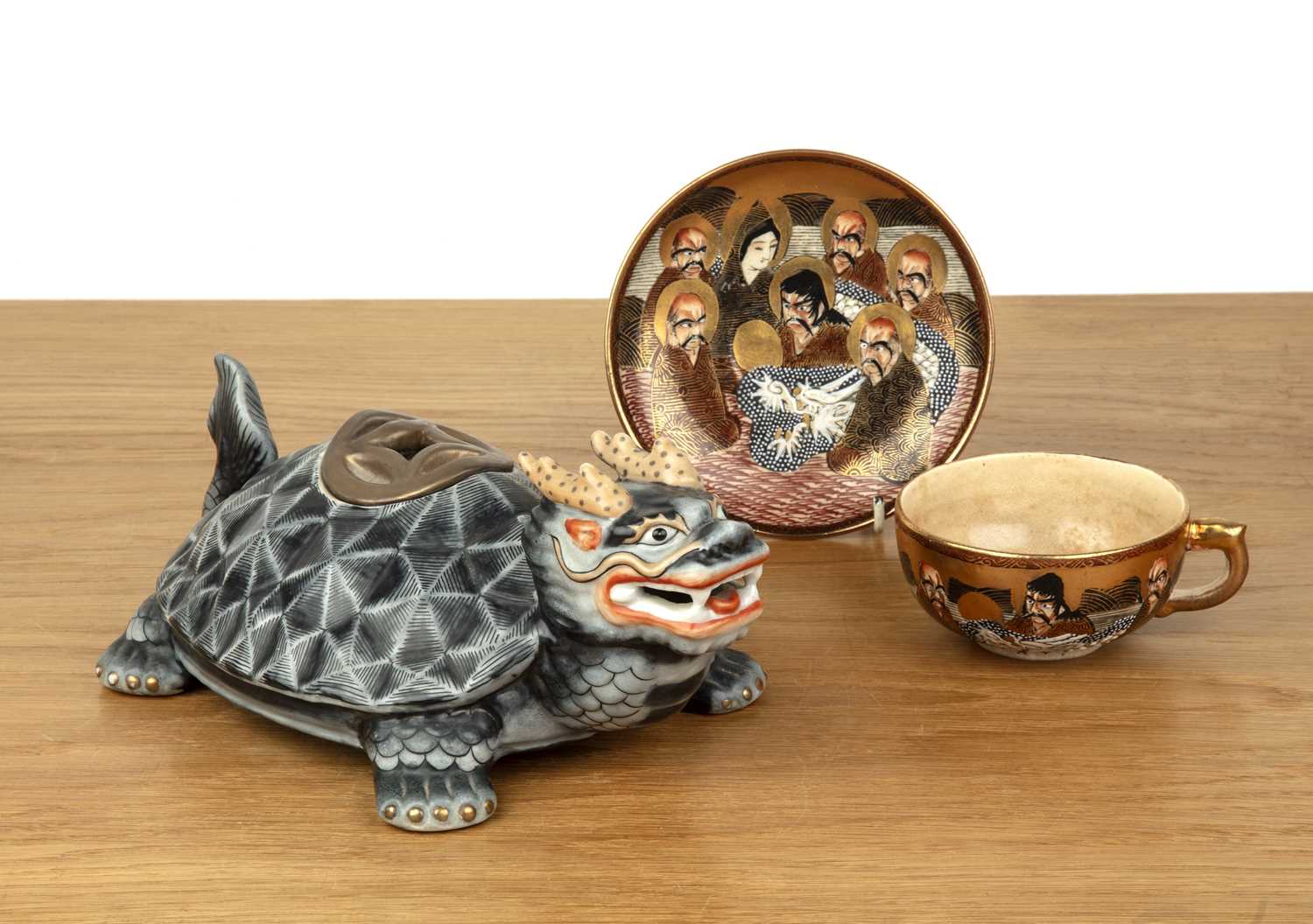 Lot 78 - Satsuma teacup and saucer and a teapot in the...