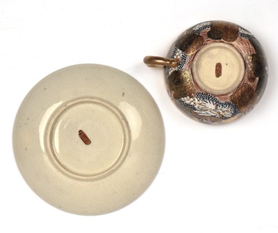Lot 78 - Satsuma teacup and saucer and a teapot in the...