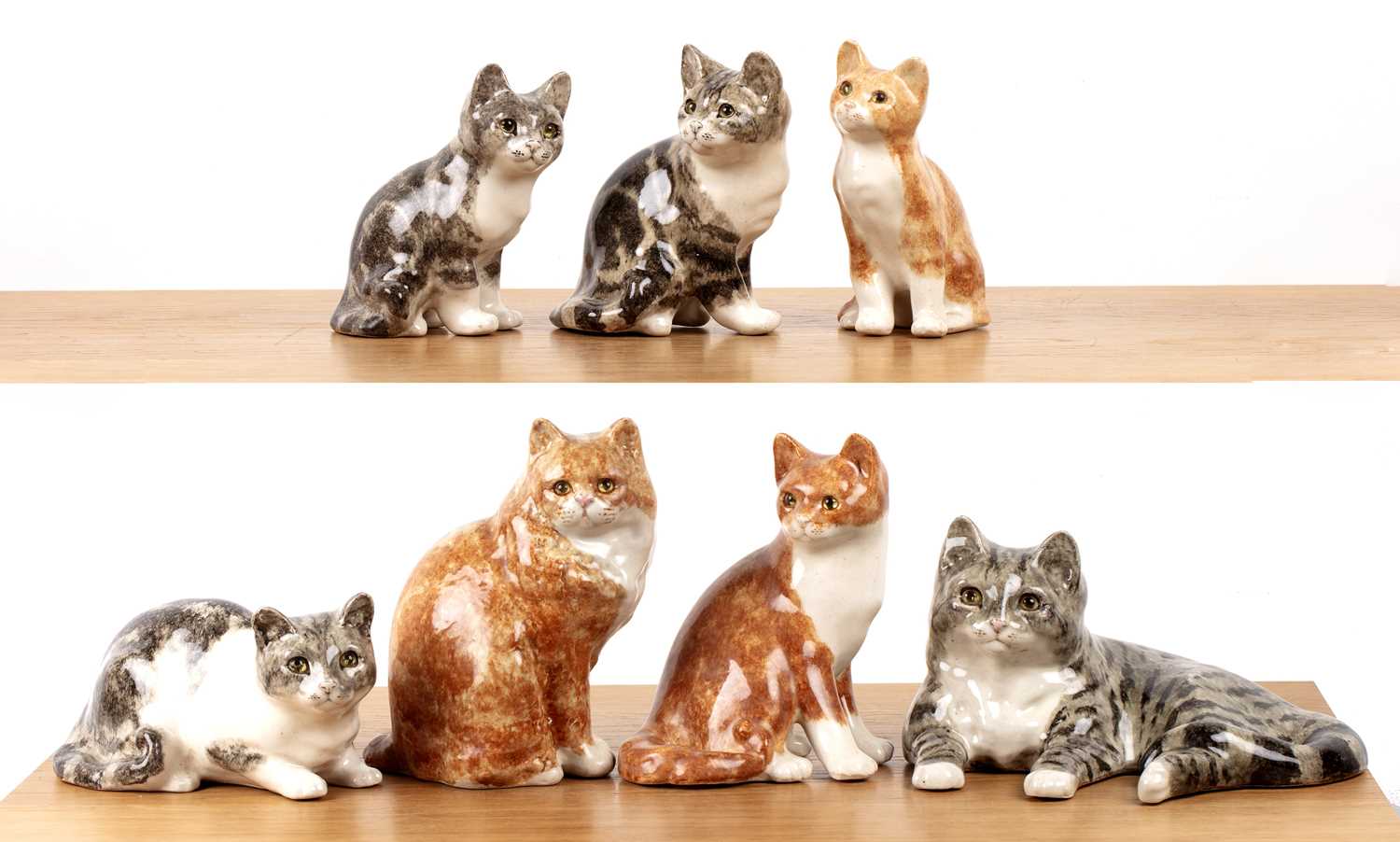 Lot 355 - Winstanley Group of seven pottery model cats...