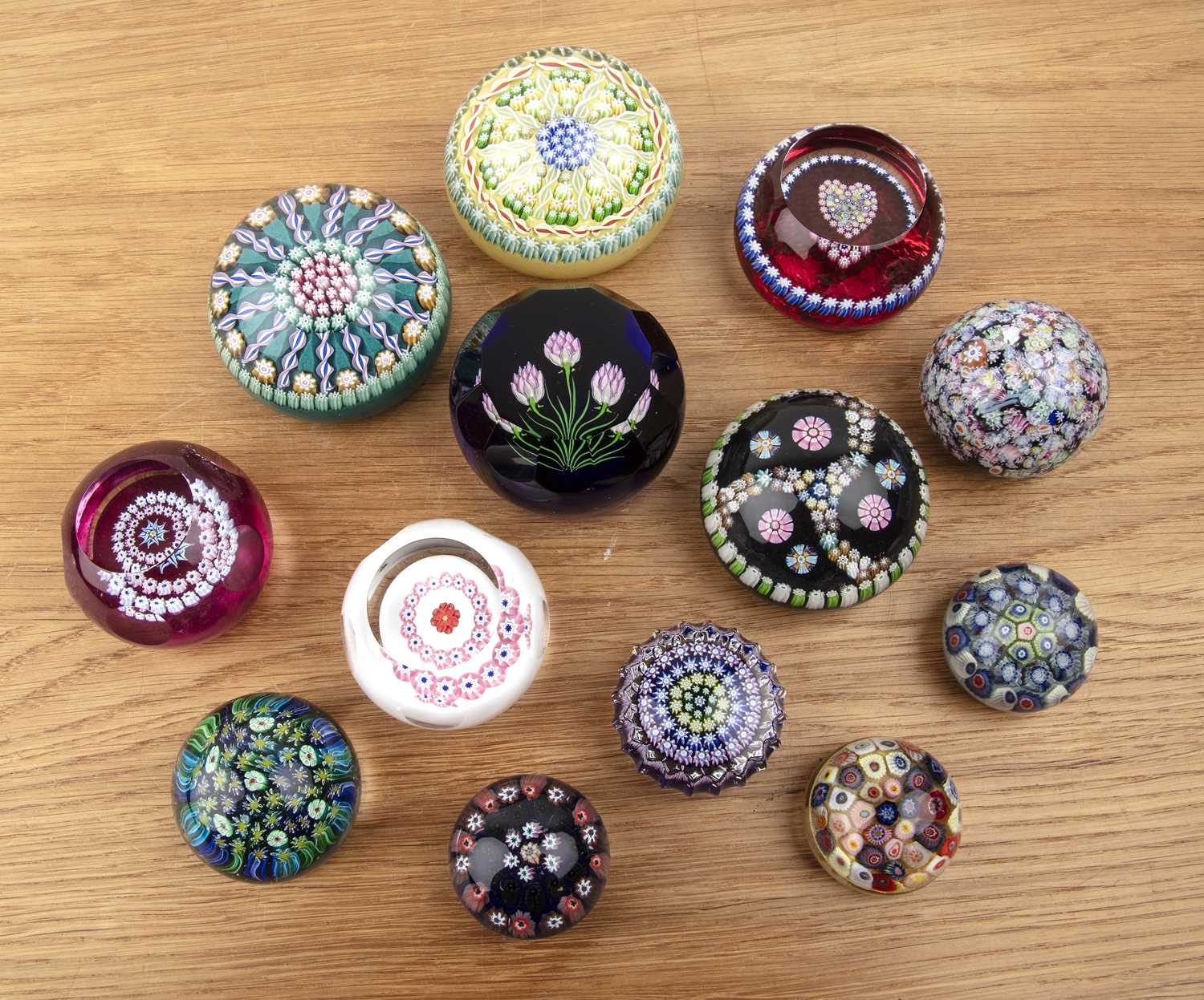Lot 434 - Group of glass millefiori cane paperweights...