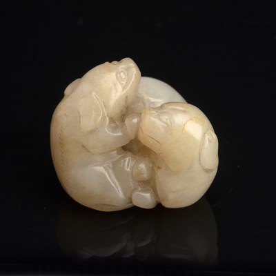 Lot 379 - Grey jade Chinese in the form of two playing...