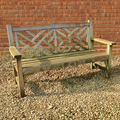 Lot 1559 - A teak garden bench