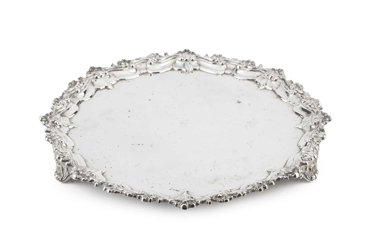 Lot 574 - A mid Victorian silver salver, with shaped...