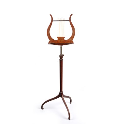 Lot 119 - An Edwardian satinwood music stand, the lyre...