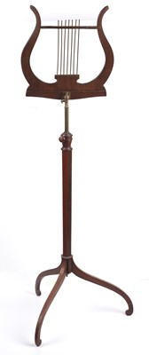 Lot 119 - An Edwardian satinwood music stand, the lyre...