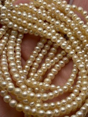 Lot 129 - A multi-strand pearl necklace with diamond set...