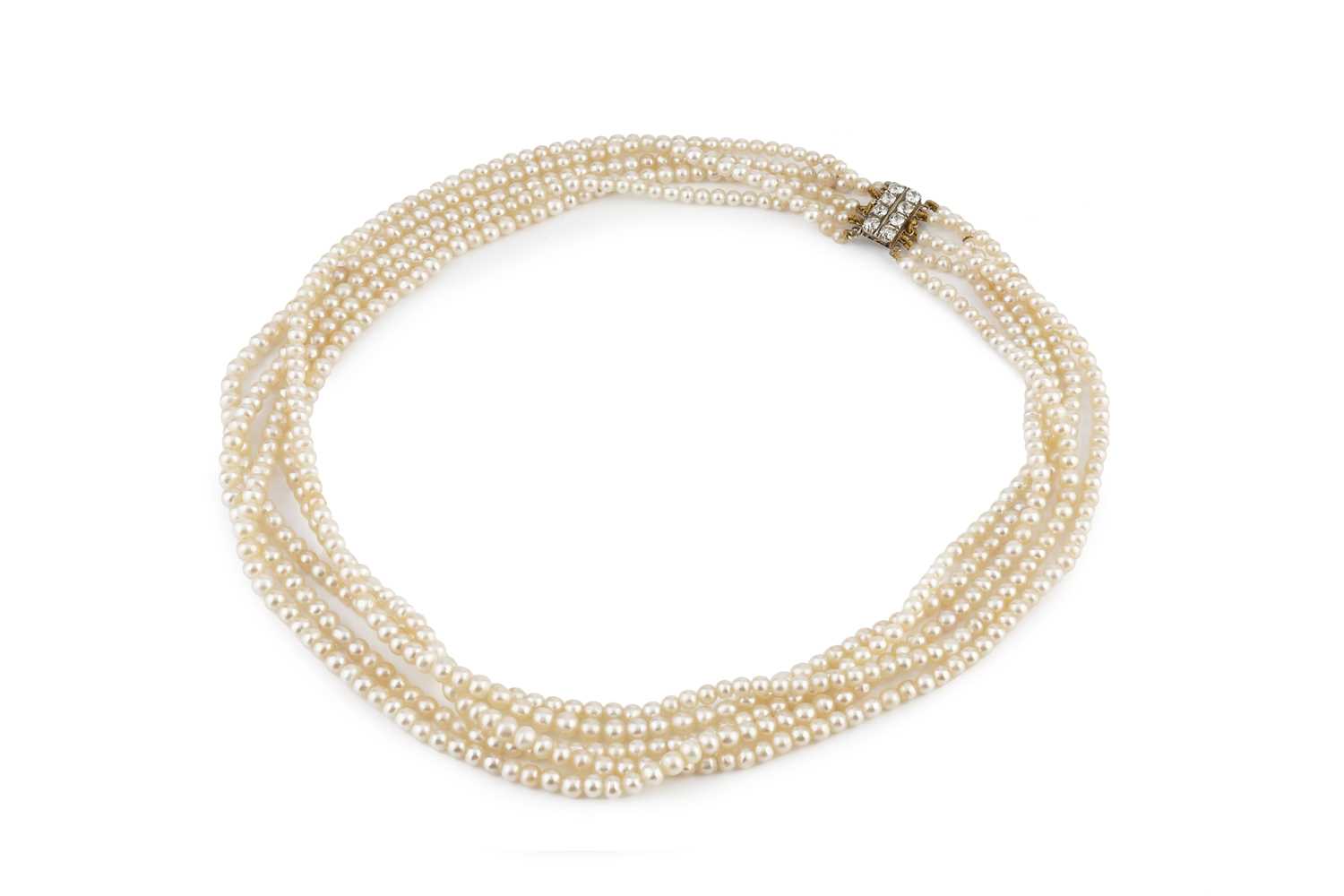 Lot 129 - A multi-strand pearl necklace with diamond set...