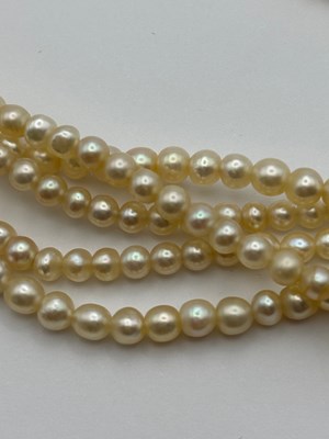 Lot 129 - A multi-strand pearl necklace with diamond set...