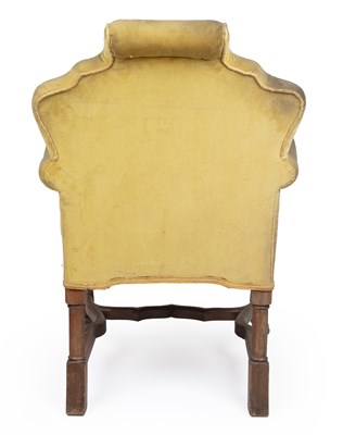 Lot 4 - A Georgian style yellow upholstered armchair...