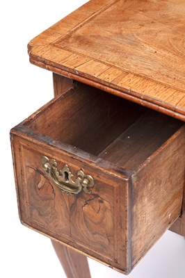 Lot 25 - A Georgian walnut lowboy