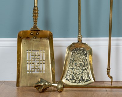 Lot 414 - Two sets of antique brass fire irons