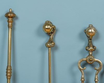 Lot 414 - Two sets of antique brass fire irons