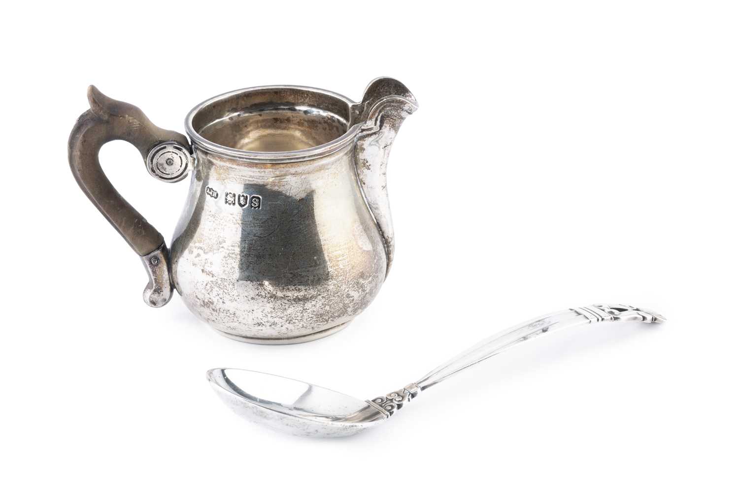 Lot 615 - A Danish silver 'acorn' pattern spoon by Georg...