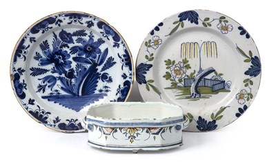 Lot 57 - An 18th century English Delft charger with a...