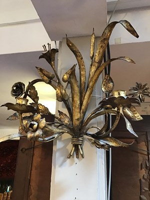 Lot 59 - A pair of gilded metal floral twin branch wall...
