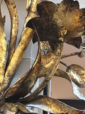 Lot 59 - A pair of gilded metal floral twin branch wall...