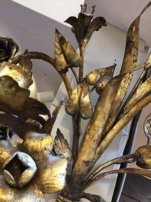 Lot 59 - A pair of gilded metal floral twin branch wall...