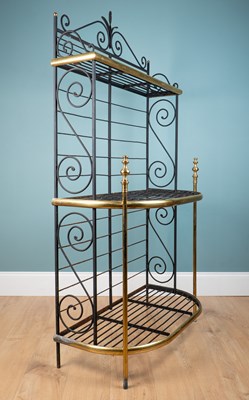 Lot 1180 - An early 20th century three-tier D-end Baker's rack