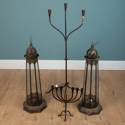 Lot 1090 - A collection of candlesticks and holders