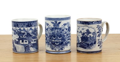 Lot 36 - Three blue and white porcelain tankards...