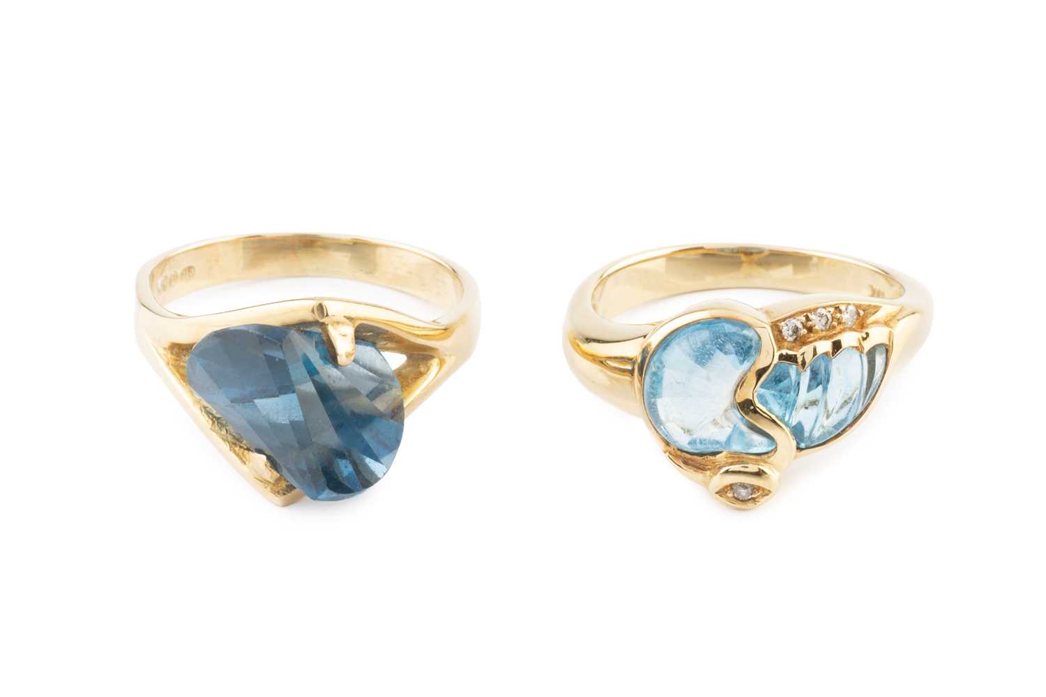 Lot 42 - A diamond and blue stone dress ring, designed...
