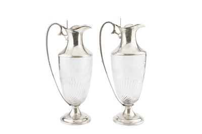 Lot 628 - A pair of late Victorian silver mounted claret...