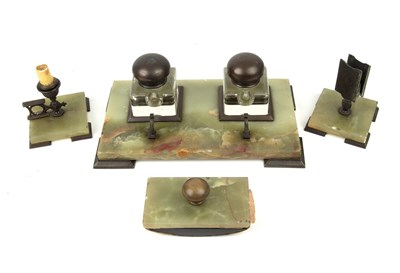 Lot 191 - An art deco century onyx desk set with a desk...