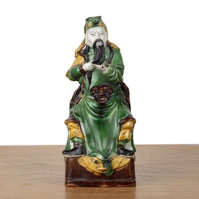 Lot 86 - Sancai glazed model of a seated scholar...