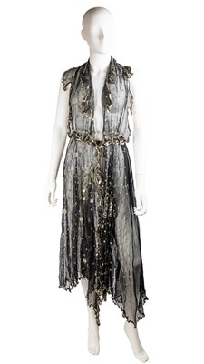 Lot 277 - A 1980’s Carol Lee halter neck black dress in...