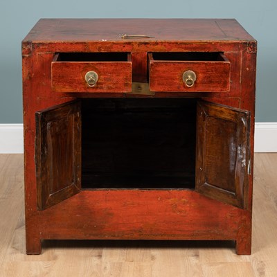 Lot 244 - A Chinese red lacquer side cabinet