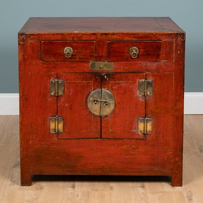 Lot 244 - A Chinese red lacquer side cabinet
