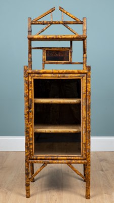 Lot 148 - A Victorian aesthetic movement bamboo and lacquer panel side cabinet