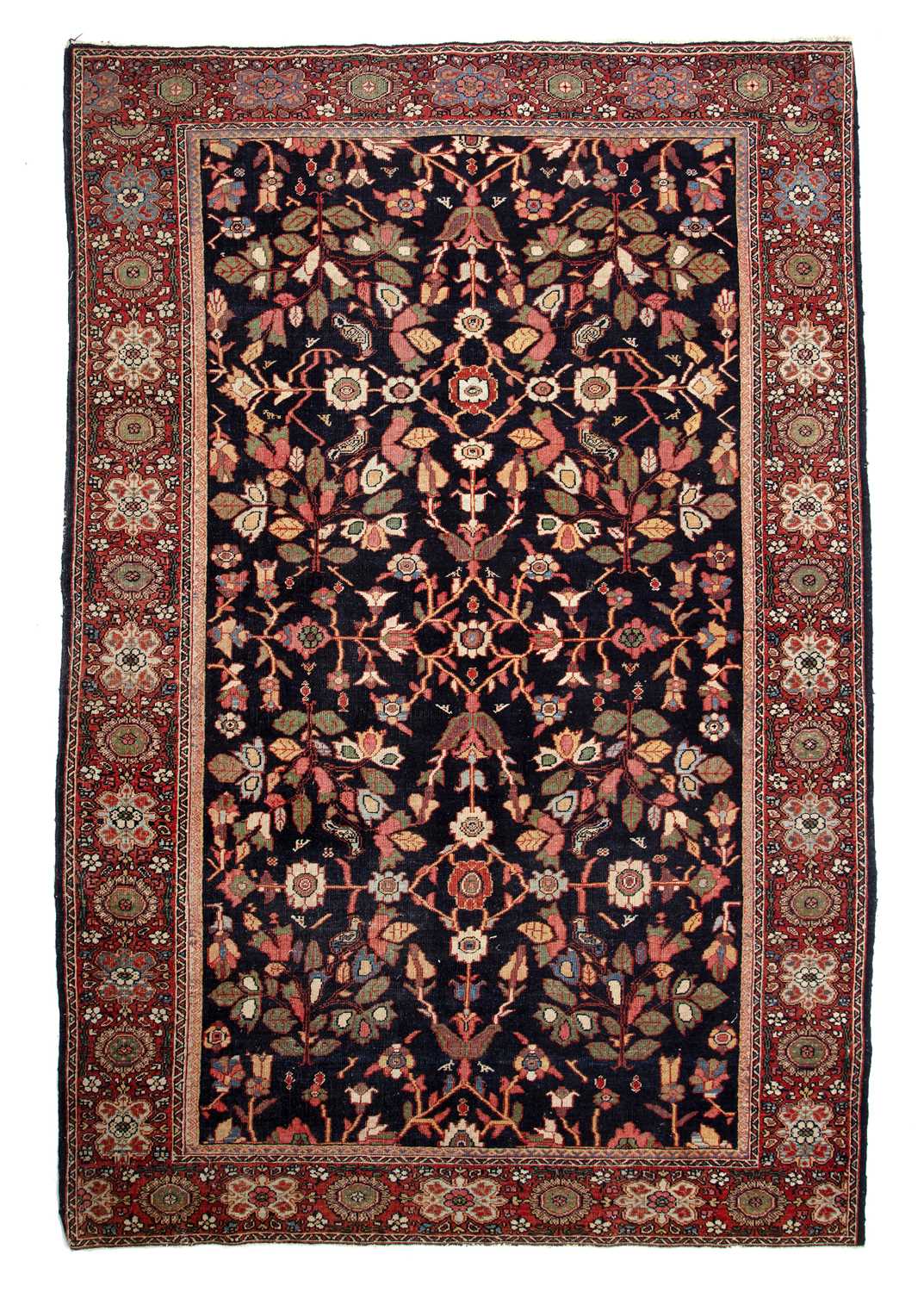 Lot 65 - A Persian blue and red ground rug with a...