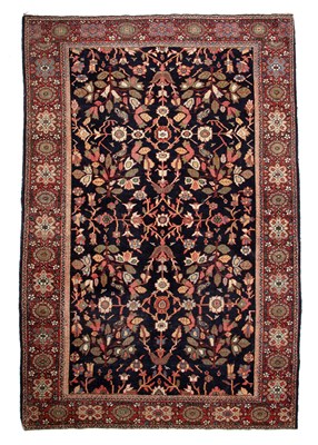 Lot 65 - A Persian blue and red ground rug with a...