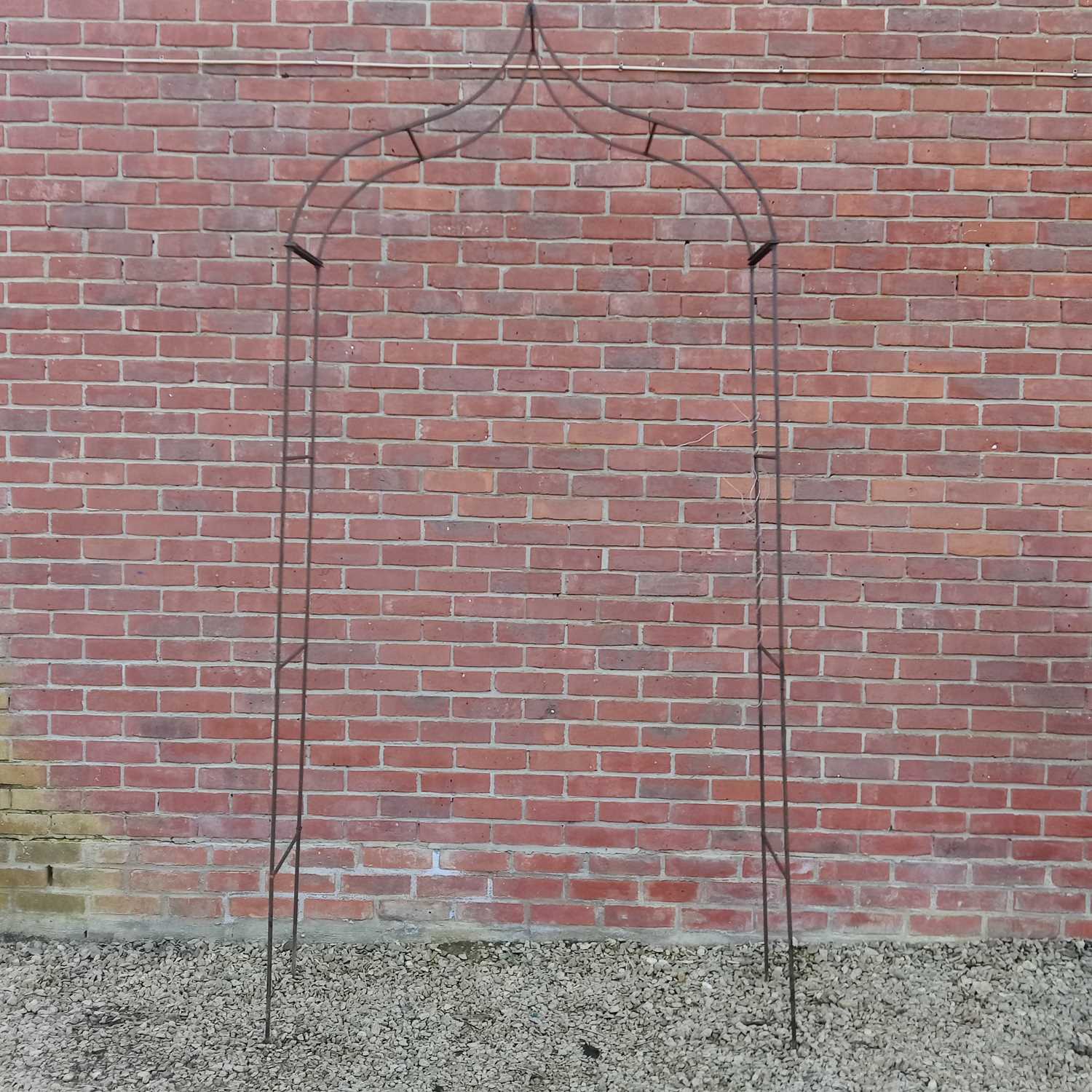 Lot 1557 - A wrought iron rose arch