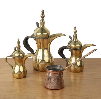 Lot 375 - Three brass and copper coffee pots and a...
