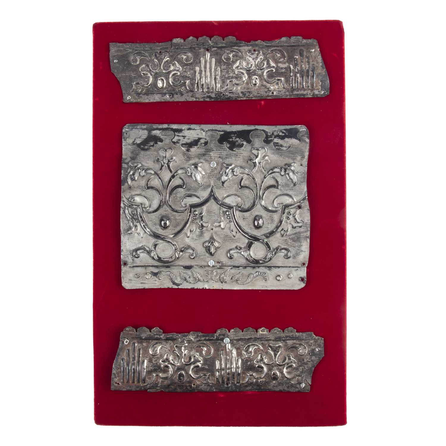 Lot 126 - Three embossed white metal fragments, possibly...