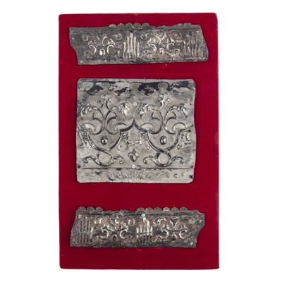Lot 126 - Three embossed white metal fragments, possibly...