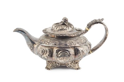 Lot A George IV silver teapot, embossed with...