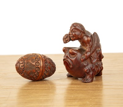 Lot 177 - Carved okimono in the form of a Daruma and a...